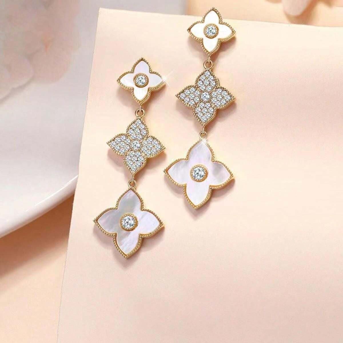 SHEIN أقراط طويلة بزينة زهرية وأحجار لامعة