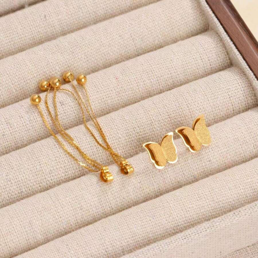 SHEIN زوج أقراط فراشة ستانلس ستيل باللون الذهبي