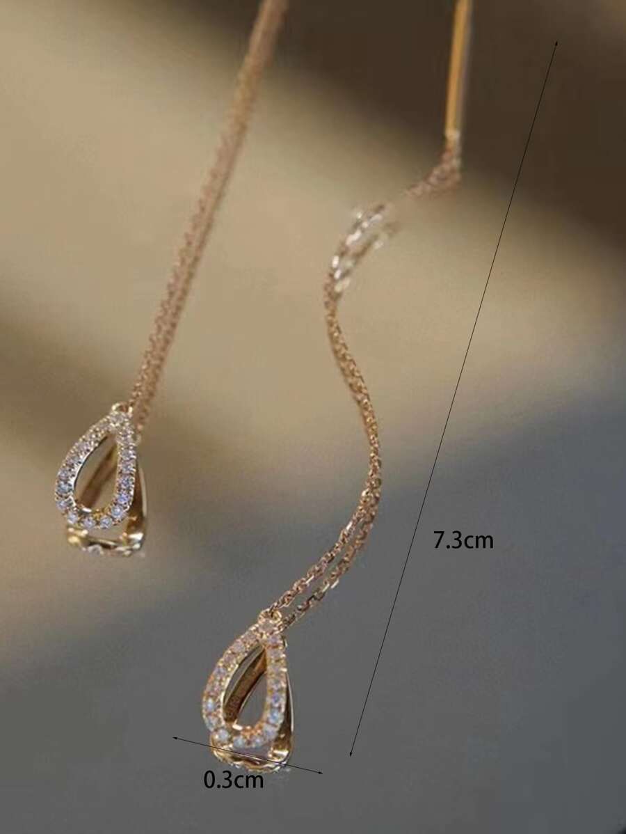 SHEIN زوج أقراط ذهبية بزخرفة حجر زركونيا على شكل قطرة ماء
