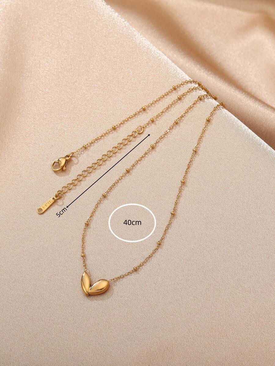 SHEIN قلادة قلب محفور ستانلس ستيل