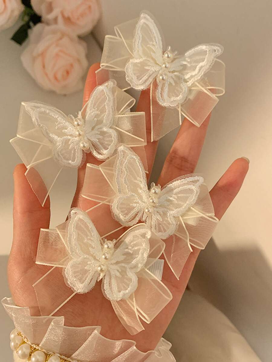 SHEIN طقم 4 قطع مشابك شعر بشكل فراشة بيضاء مزينة خرز وقماش