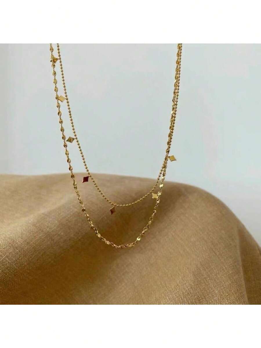 SHEIN قلادة فولاذية بطبقتين مزينة بخيوط كشكشة وخرز ذهبي