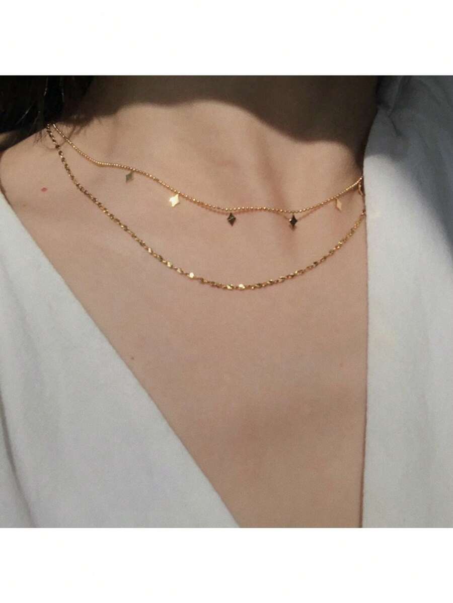 SHEIN قلادة فولاذية بطبقتين مزينة بخيوط كشكشة وخرز ذهبي