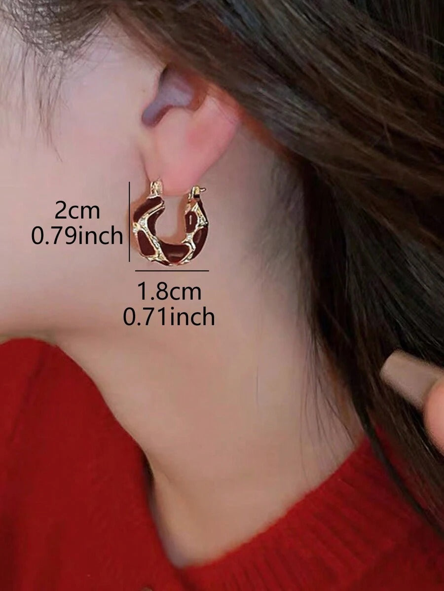 SHEIN  أقراط مع تصميم دائري