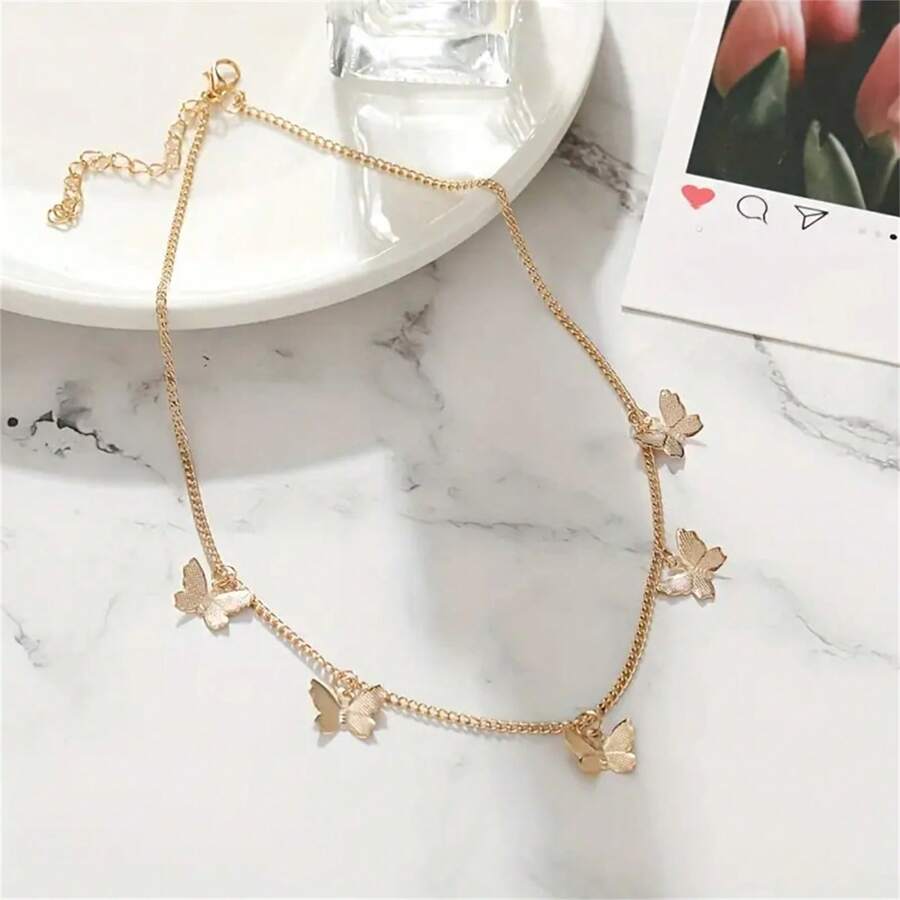 SHEIN قلادة بتصميم نجمي وفراشة مطلية بالذهب