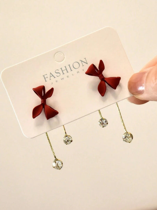 SHEIN أقراط أنيقة بتصميم عقدة الفراشة