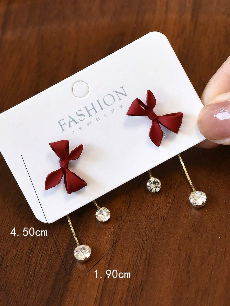 SHEIN أقراط أنيقة بتصميم عقدة الفراشة