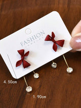 SHEIN أقراط أنيقة بتصميم عقدة الفراشة