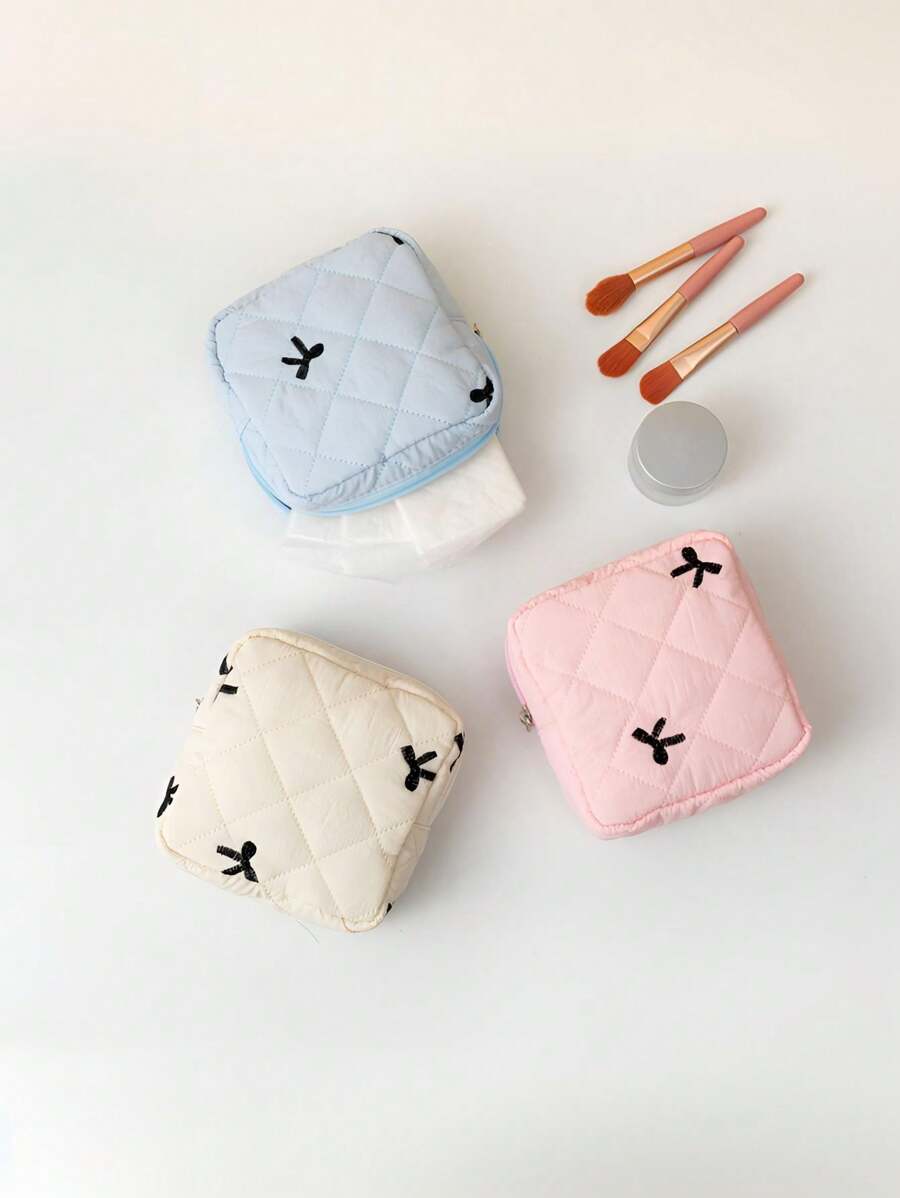 SHEIN حقيبة مكياج صغيرة محمولة بسحاب ونمط فيونكة