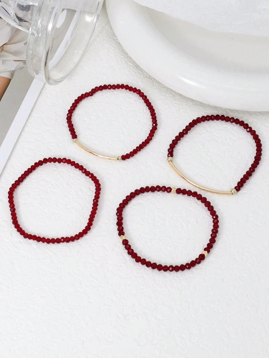 SHEIN طقم 4 أساور إيلاستيكية ذهبية من خرز بلوري أحمر