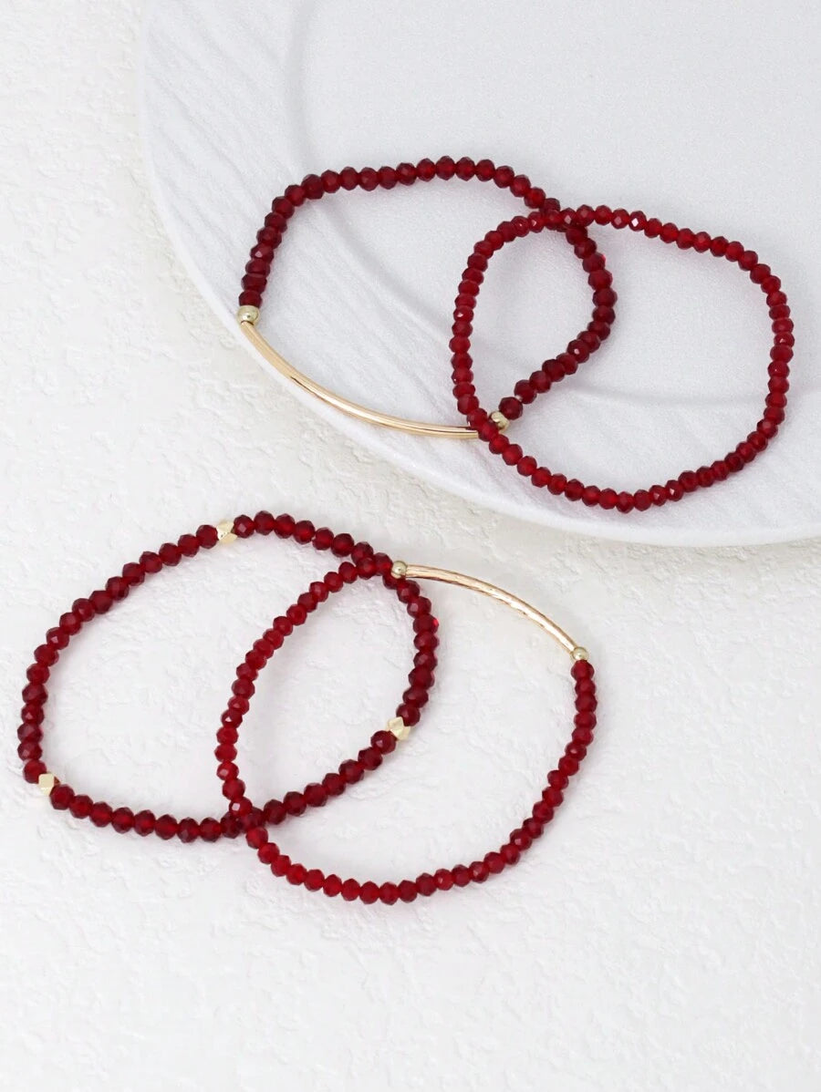 SHEIN طقم 4 أساور إيلاستيكية ذهبية من خرز بلوري أحمر