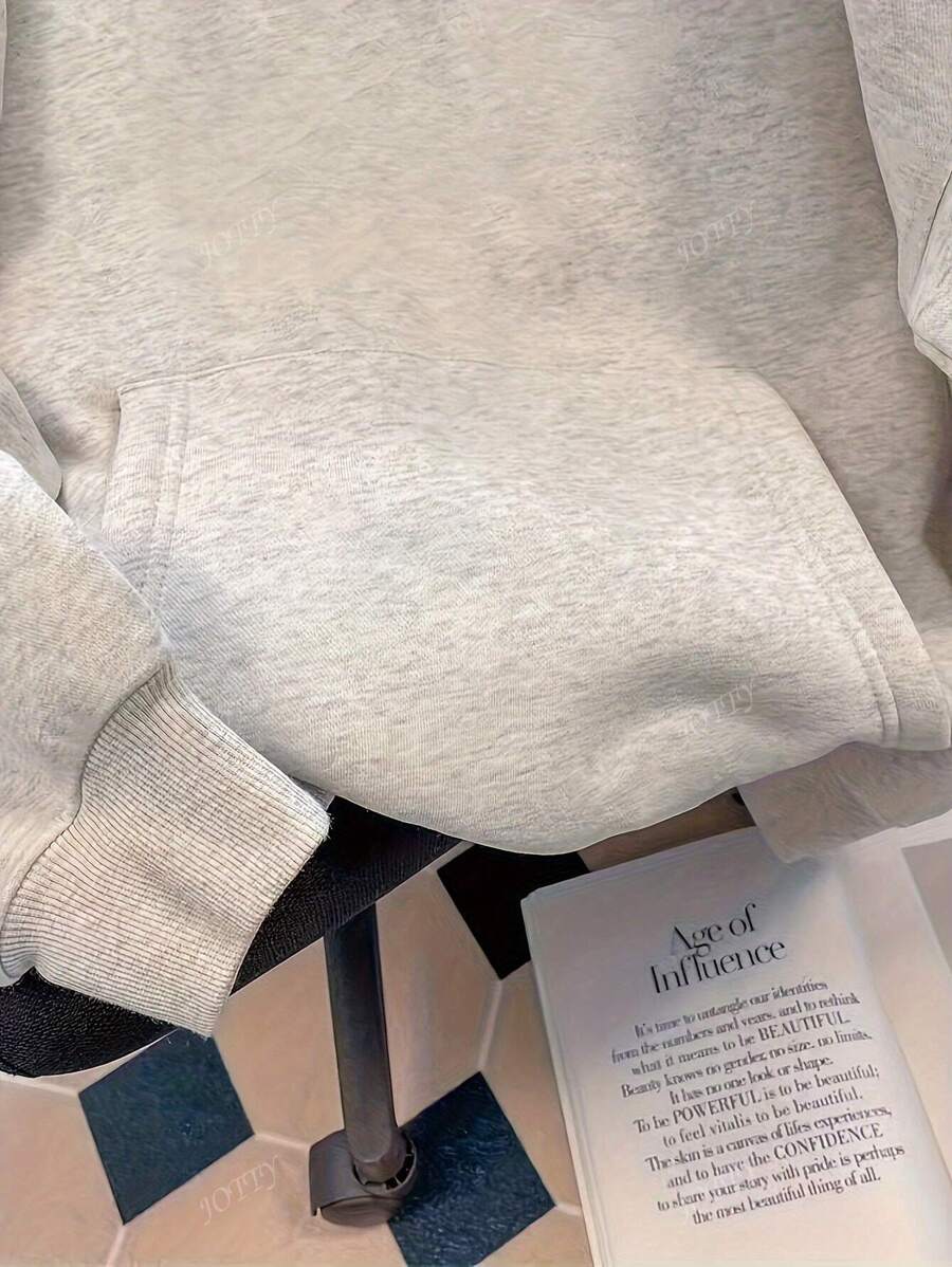 SHEIN هودي كاجوال بأكمام طويلة وجيب أمامي بلون سادة