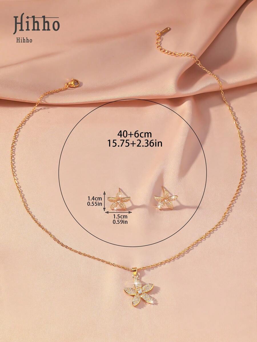 SHEIN مجموعة مجوهرات 3 قطع ذهبية بزهرات مرصعة بزركونيا