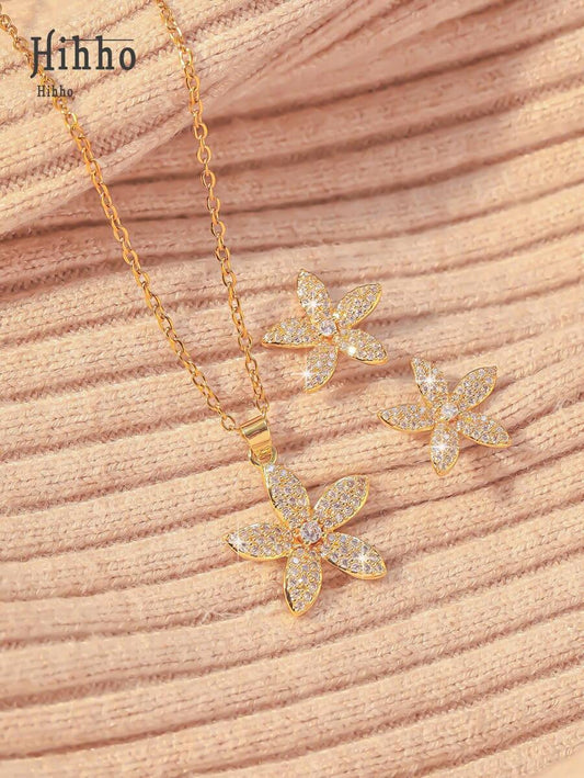 SHEIN مجموعة مجوهرات 3 قطع ذهبية بزهرات مرصعة بزركونيا