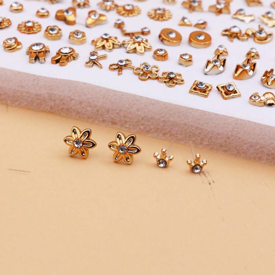 SHEIN طقم 100 زوج أقراط رينستون مطلية بالذهب بتصاميم بلاستيكية