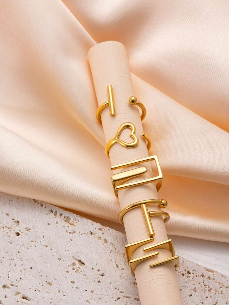 SHEIN طقم 5 خواتم ذهبي من الفولاذ المقاوم للصدأ