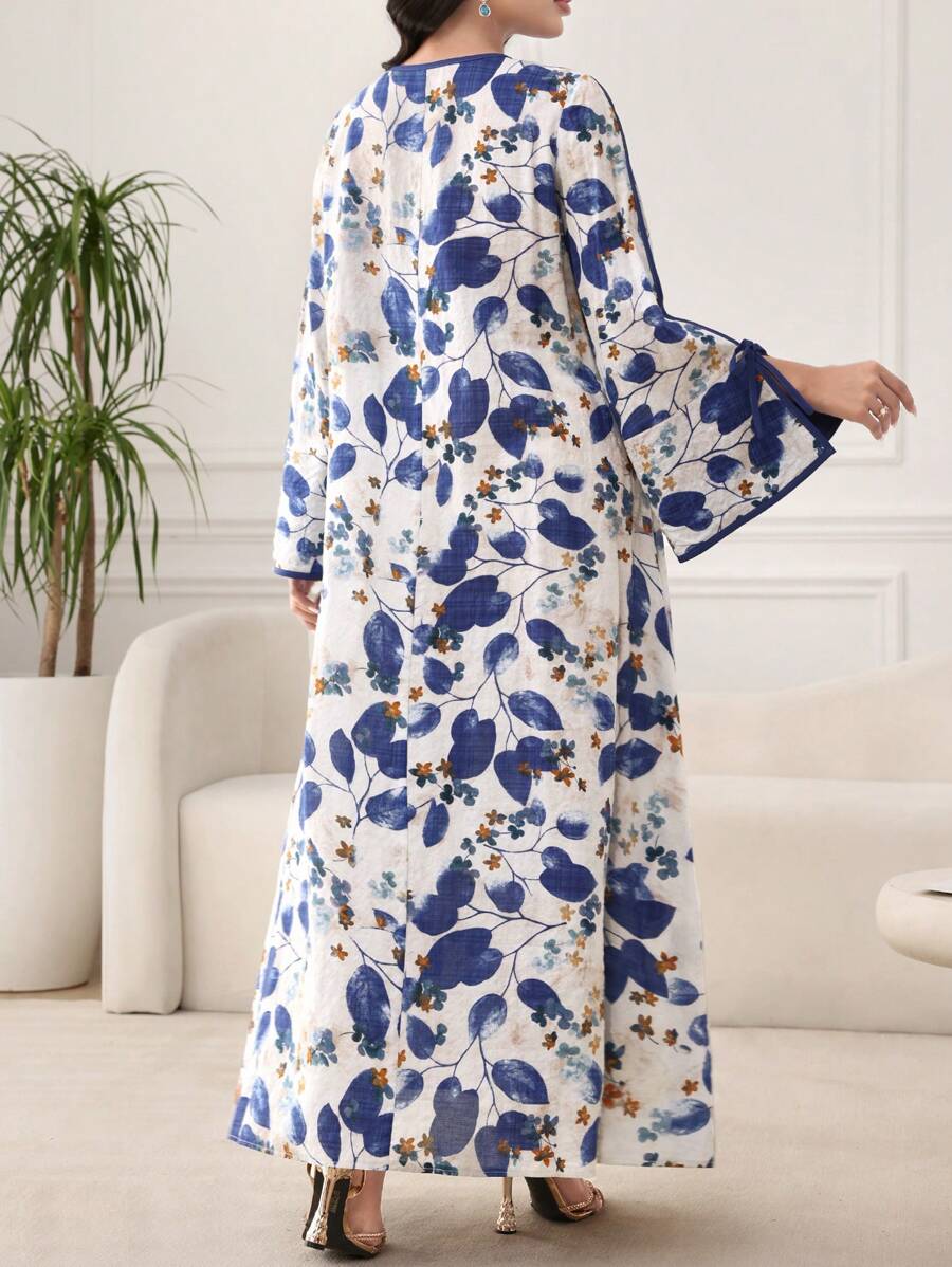 SHEIN Al Najma فستان فضفاض ازرق بطبعة نباتية وأكمام متسعة