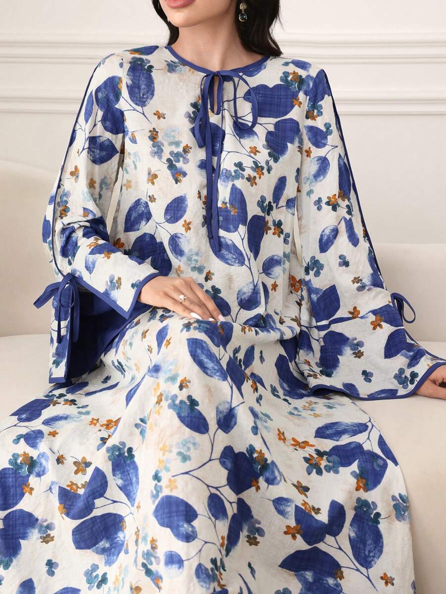 SHEIN Al Najma فستان فضفاض ازرق بطبعة نباتية وأكمام متسعة