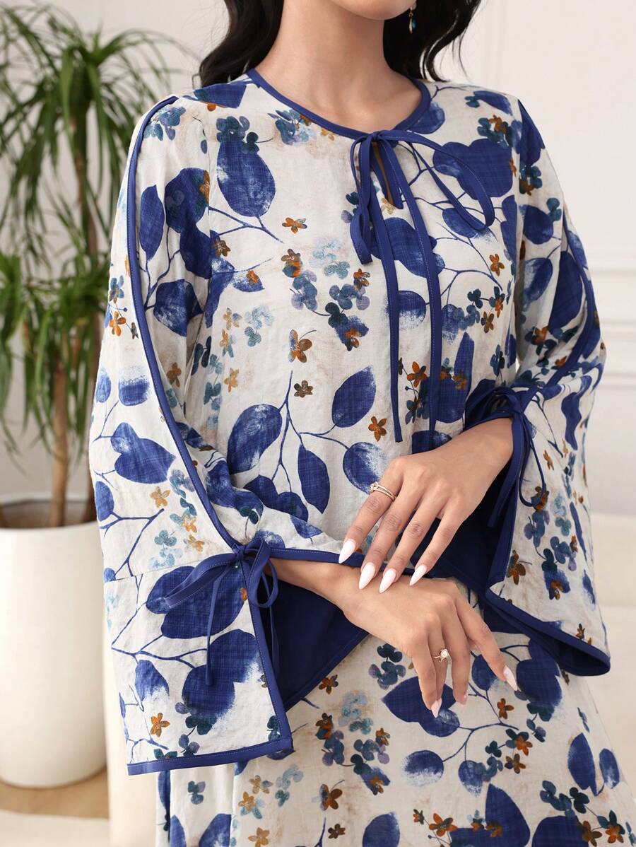 SHEIN Al Najma فستان فضفاض ازرق بطبعة نباتية وأكمام متسعة