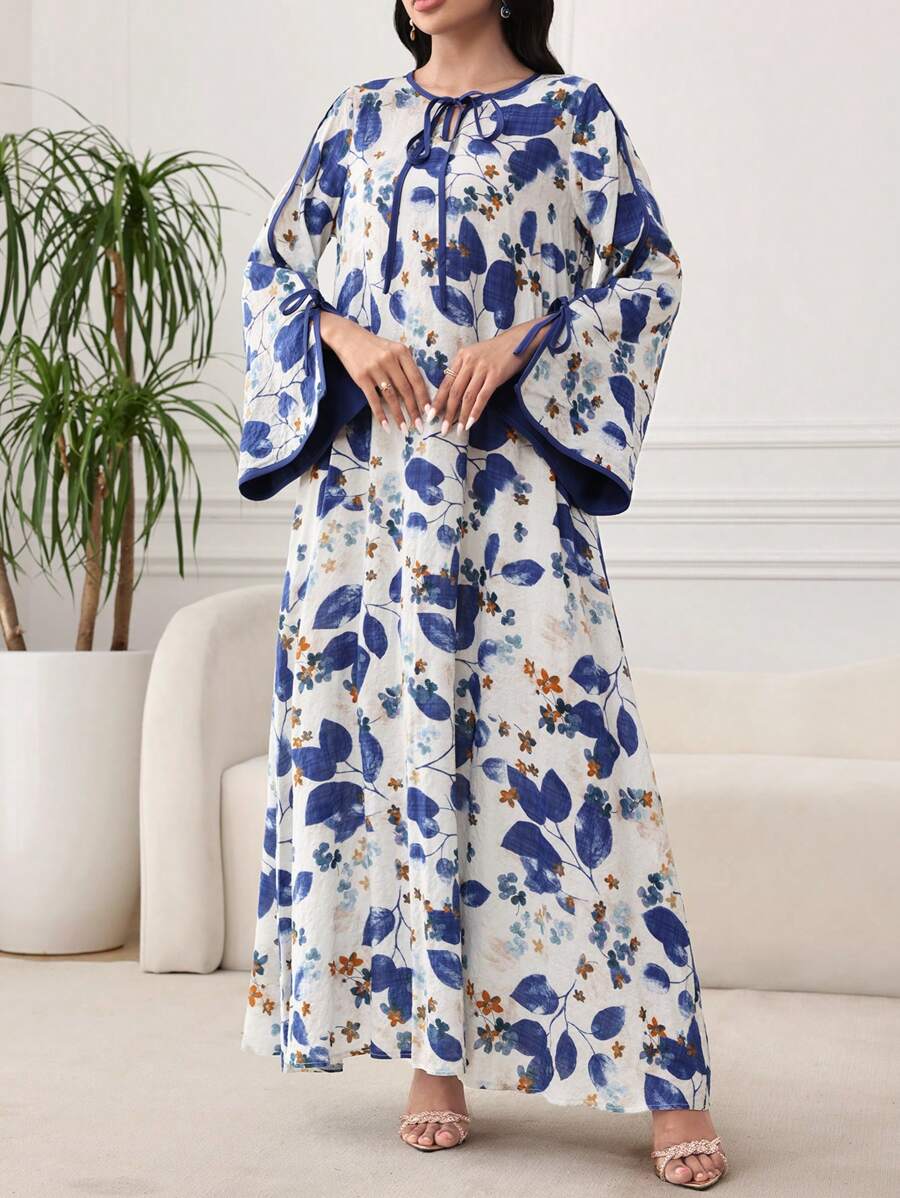 SHEIN Al Najma فستان فضفاض ازرق بطبعة نباتية وأكمام متسعة
