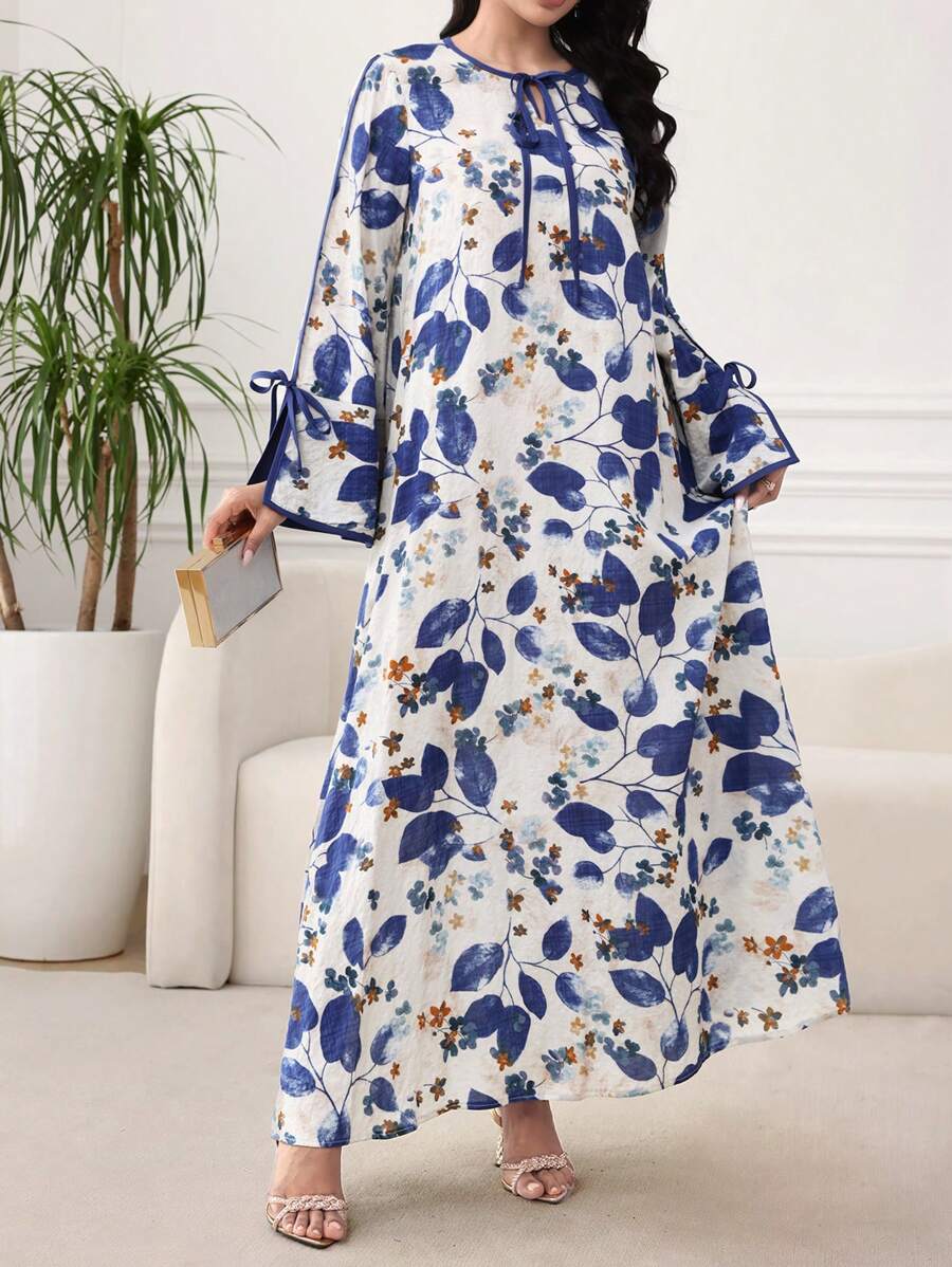 SHEIN Al Najma فستان فضفاض ازرق بطبعة نباتية وأكمام متسعة
