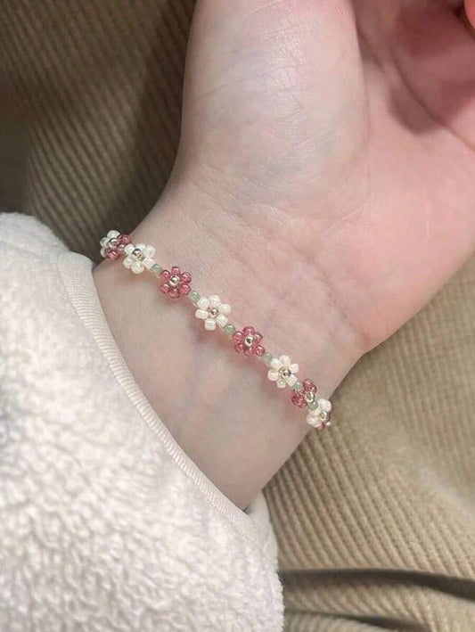 SHEIN سوار مطاطي مزين بخرز زهرة أبيض قابل للتعديل