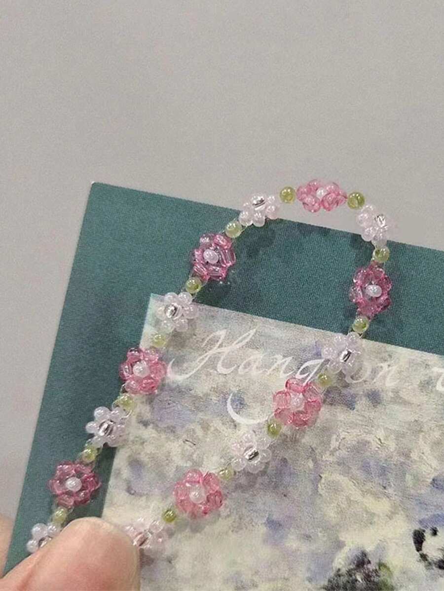 SHEIN سوار مطاطي مزين بخرز زهرة أبيض قابل للتعديل