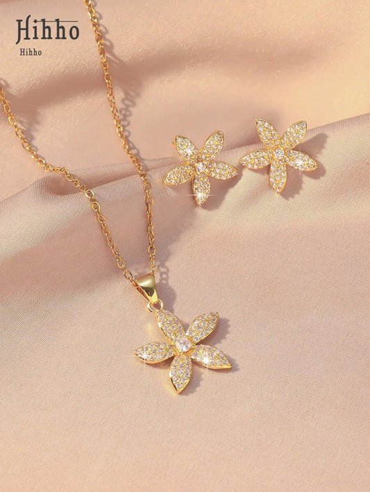 SHEIN مجموعة مجوهرات 3 قطع ذهبية بزهرات مرصعة بزركونيا