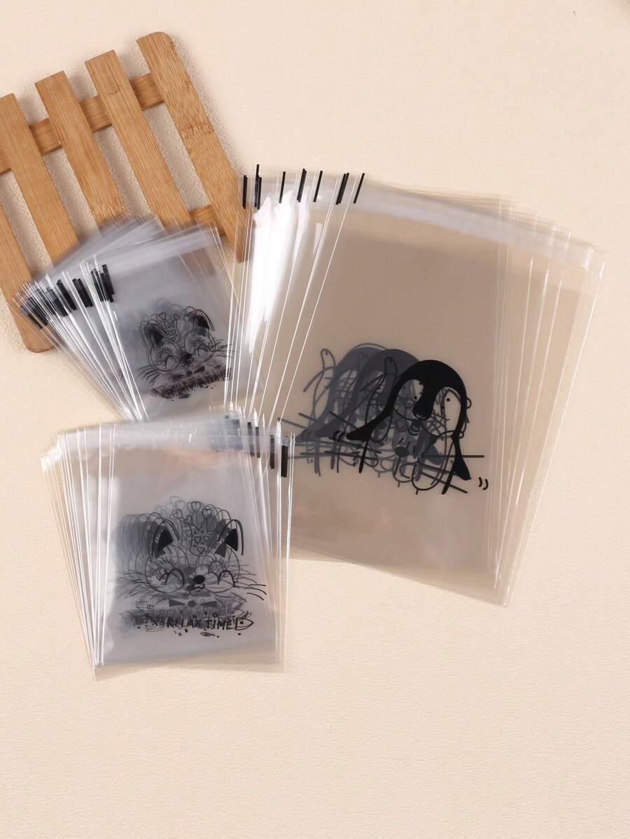 SHEIN كيس خبز شفاف 100 قطعة ذاتي اللصق بتصميمات كرتونية