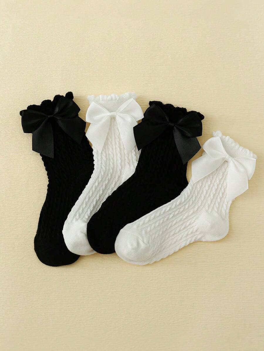 SHEIN طقم 4 جوارب بنات قصيرة سوداء وبيضاء مزينة بفيونكة