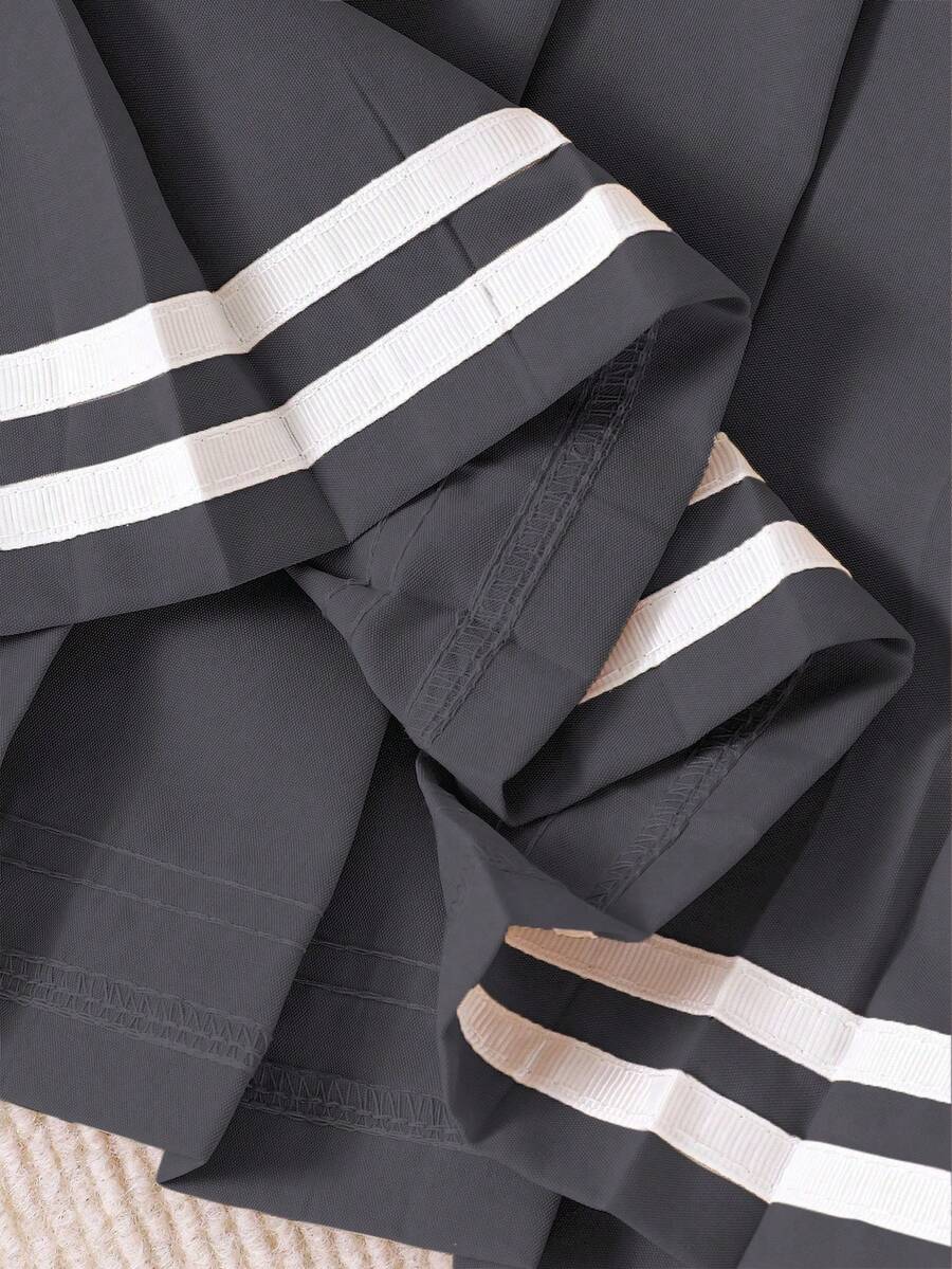 SHEIN تنورة مطوية مزينة بشريط للفتيات الصغيرات