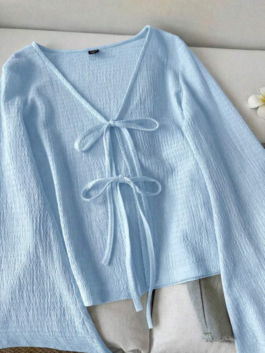 SHEIN LUNE بلوزة كاجوال بأكمام واسعة وربطات على الأساور