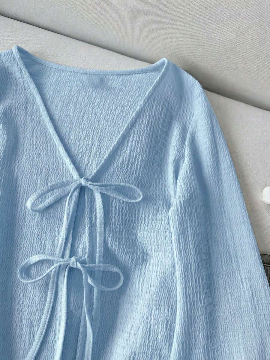 SHEIN LUNE بلوزة كاجوال بأكمام واسعة وربطات على الأساور