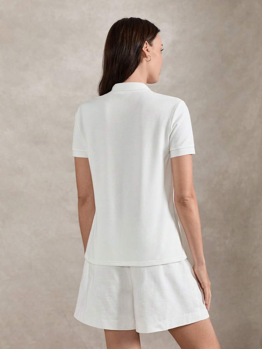 SHEIN Briarwyn تي شيرت بولو أبيض بأكمام قصيرة وتطريز دب