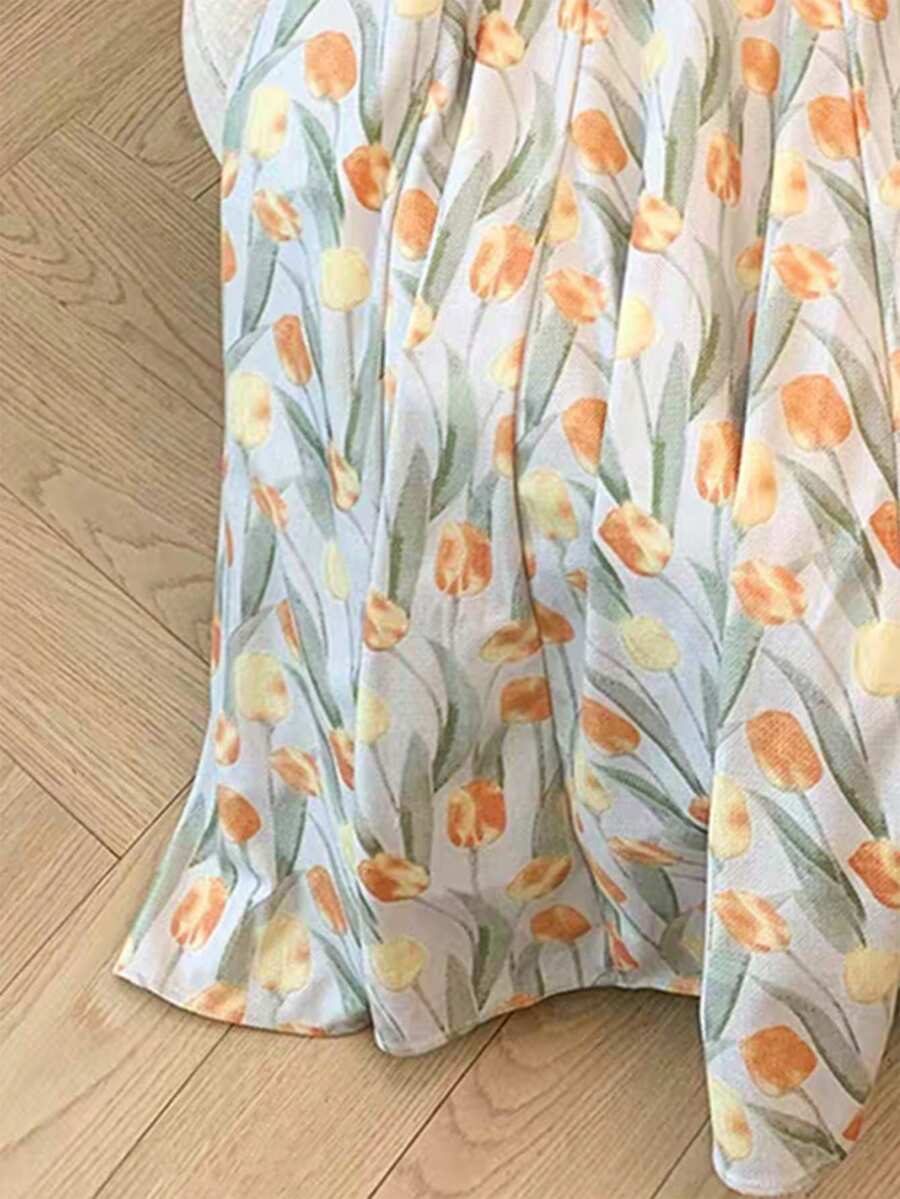 SHEIN GLOWEVE فستان بدون أكمام بطبعة زهور الزنبق بتصميم فني مزخرف