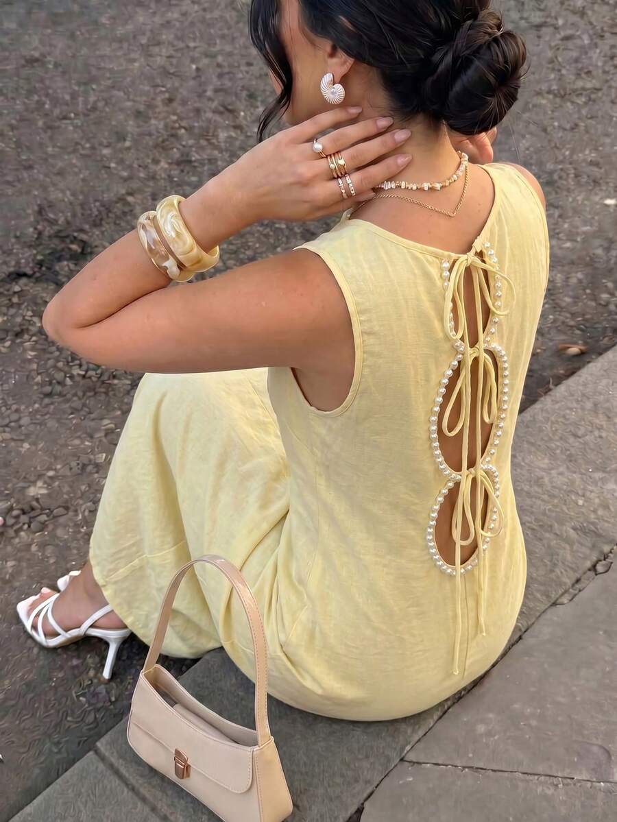 SHEIN ELENZGA فستان أصفر فاتح بدون أكمام بعقدة فراشة وتنورة واسعة