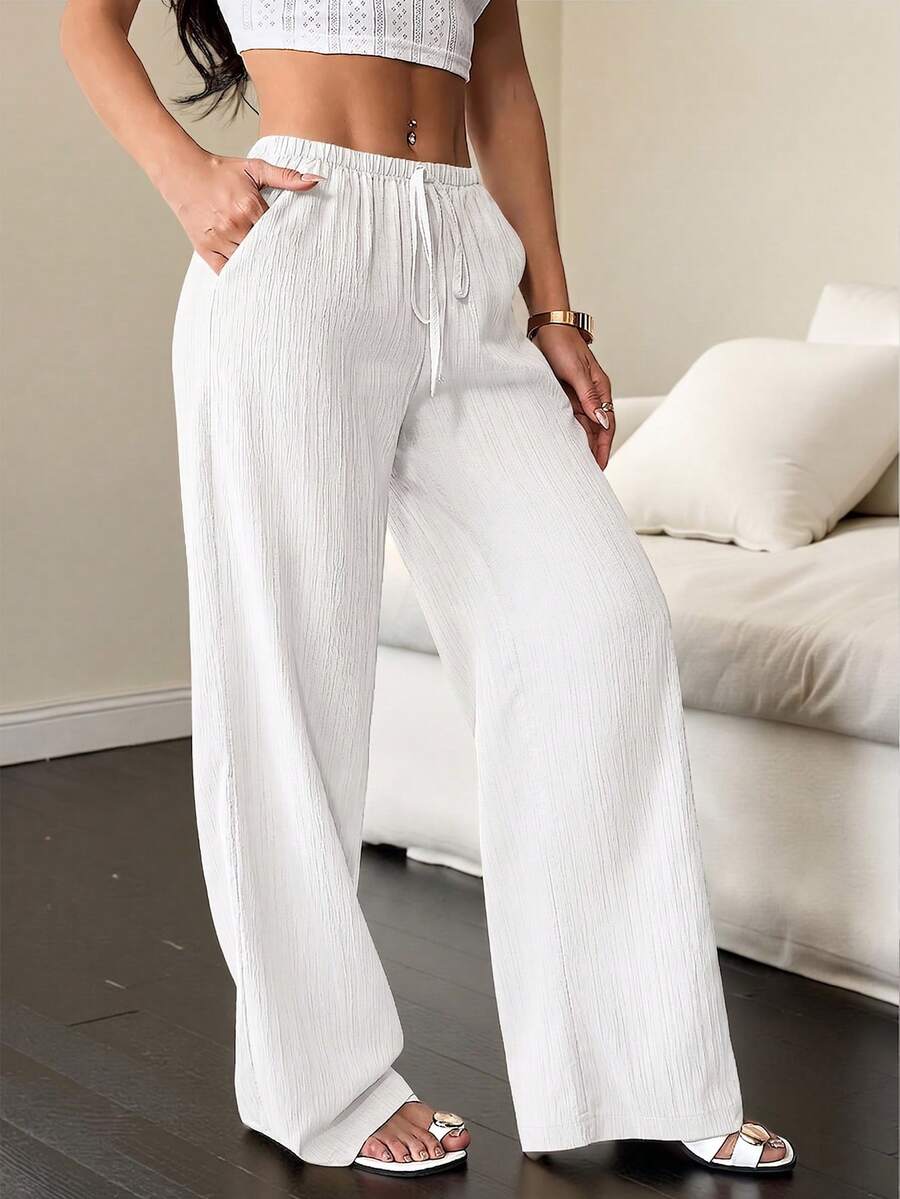 SHEIN Flirla بنطلون أبيض واسع بقصة فضفاضة وجيوب ملتوية