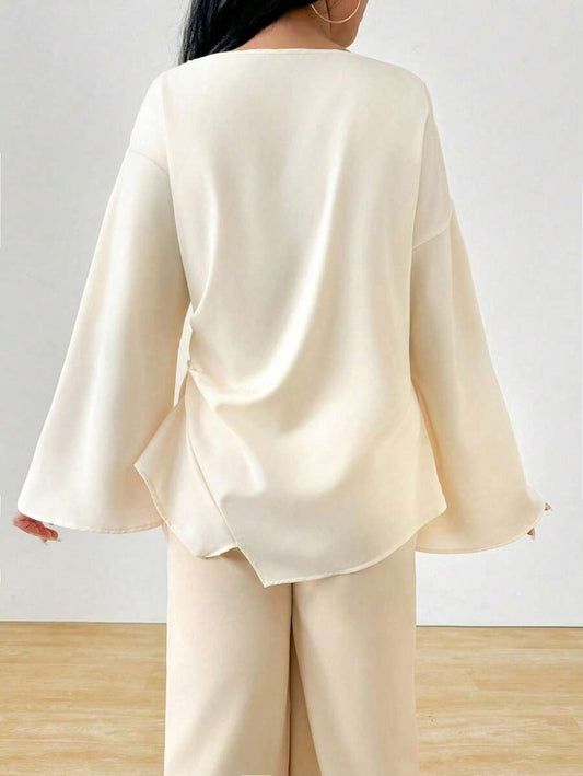 SHEIN INAWLY  بلوزة ناعمة بطول مميز وقصة أنثوية
