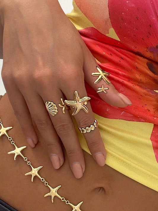 SHEIN ROMWE طقم 4 خواتم ذهبية بتصميم بحري