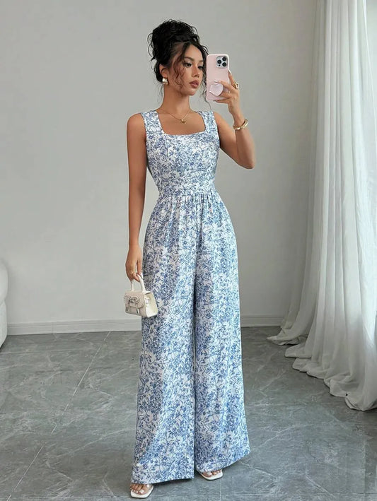 SHEIN Breezaya جمبسوت بطبعة زهور أنيقة بظهر مكشوف
