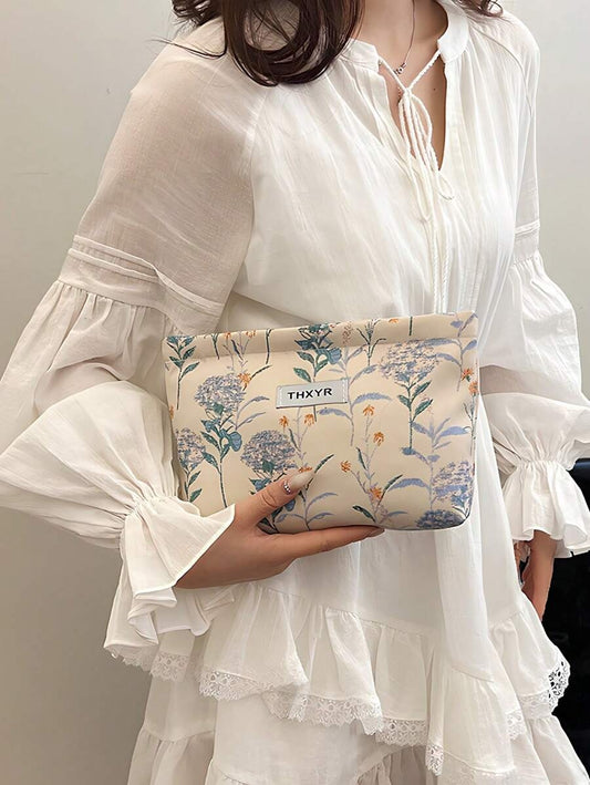 SHEIN حقيبة مكياج زرقاء واسعة بطبعة زهور أنيقة