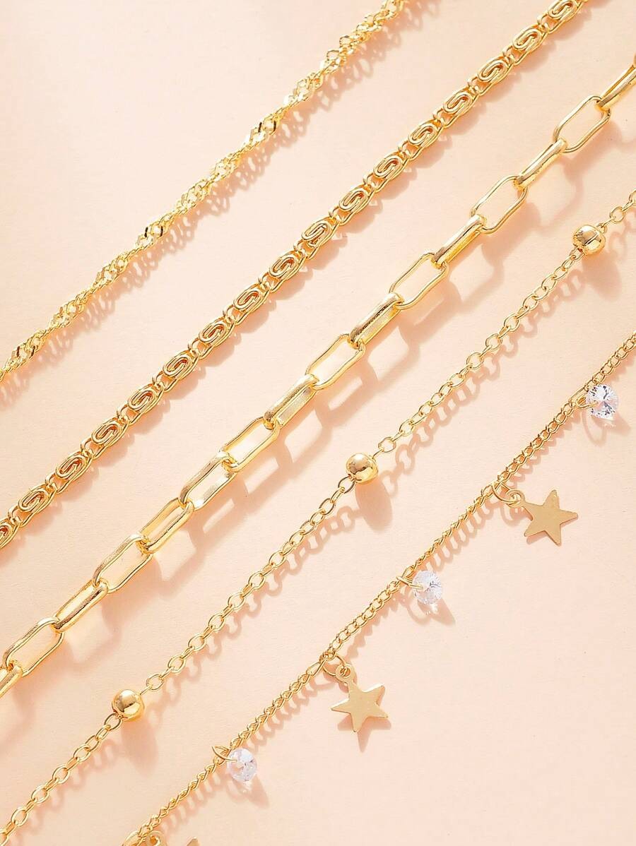 SHEIN طقم 4 اساور ذهبية بزركونيا ونجمة