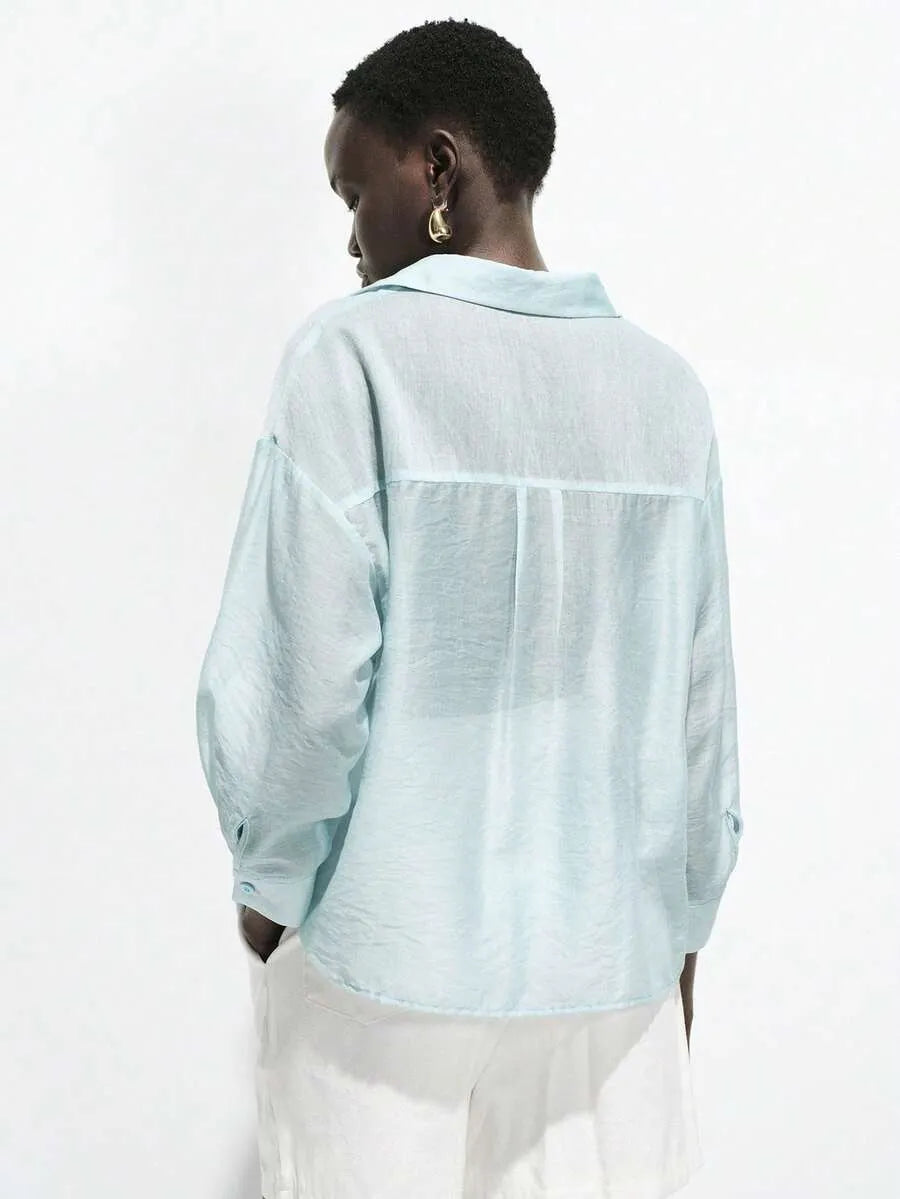 SHEIN Lumivelle قميص نسائي فضفاض شفاف بأزرار وجيب وأكمام 3/4 بلون أزرق