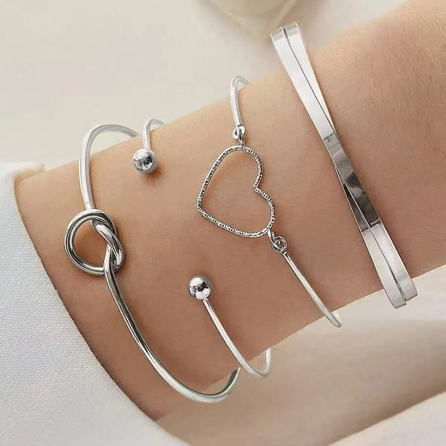 SHEIN مجموعة 4 قطع أساور نسائية مضفرة وملتوية بتصميم قلب