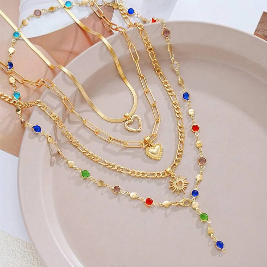 SHEIN قلادات متعددة الطبقات بشكل قلب ذهبي وراين ملون 4 قطع