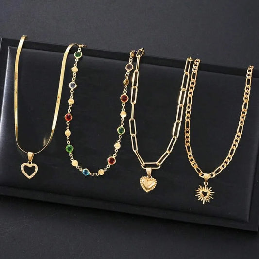 SHEIN قلادات متعددة الطبقات بشكل قلب ذهبي وراين ملون 4 قطع