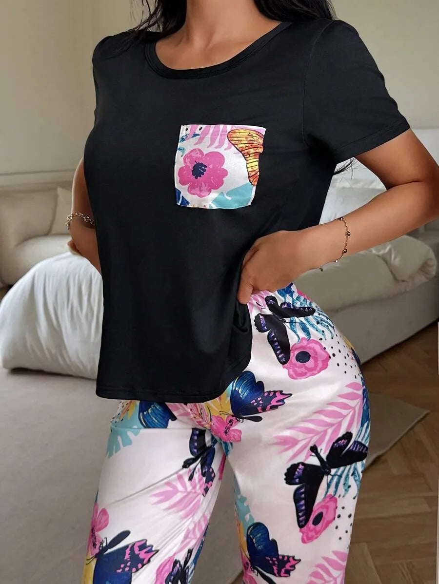 SHEIN طقم بيجامة قطعتين بأكمام قصيرة وبنطلون طويل بطبعة زهور وفراشات بلون أسود