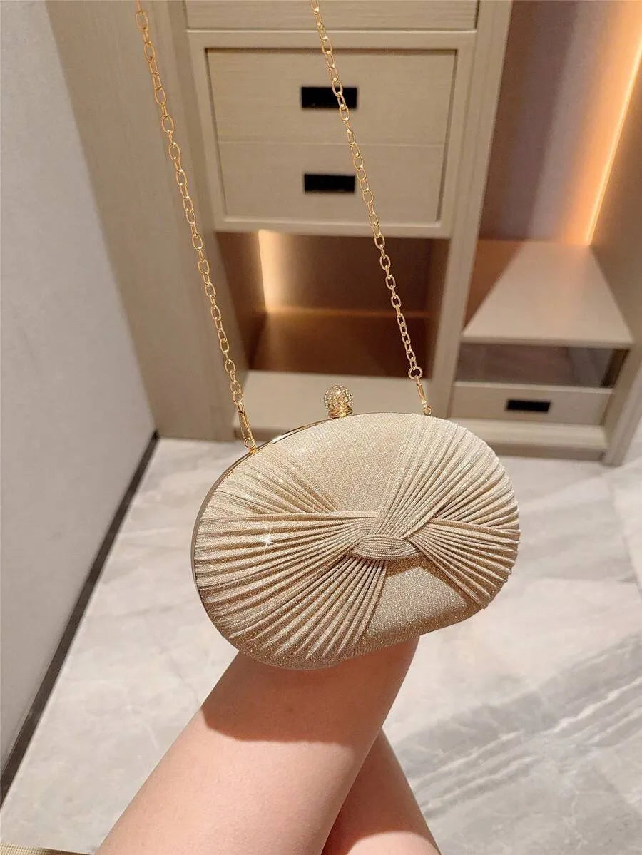 SHEIN حقيبة كلاتش بيضاوية صغيرة لامعة بفيونكة ورصاص ألماسي