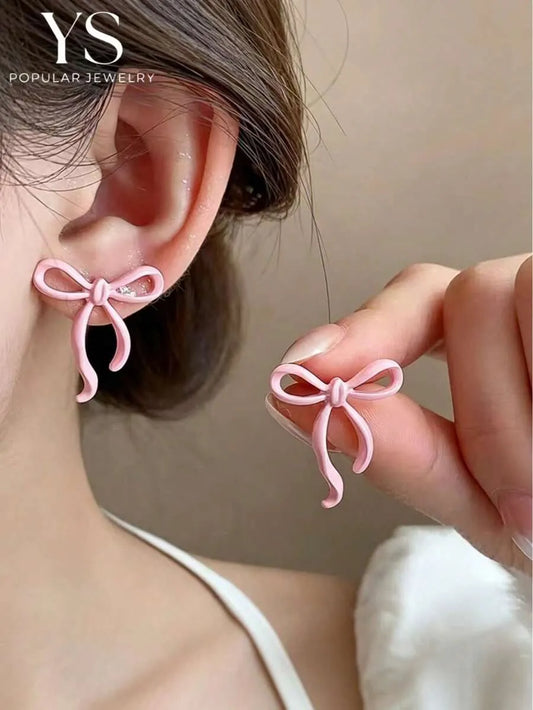 SHEIN زوج أقراط دبابيس بتصميم شريط فراشة بألوان وردية للربيع والصيف