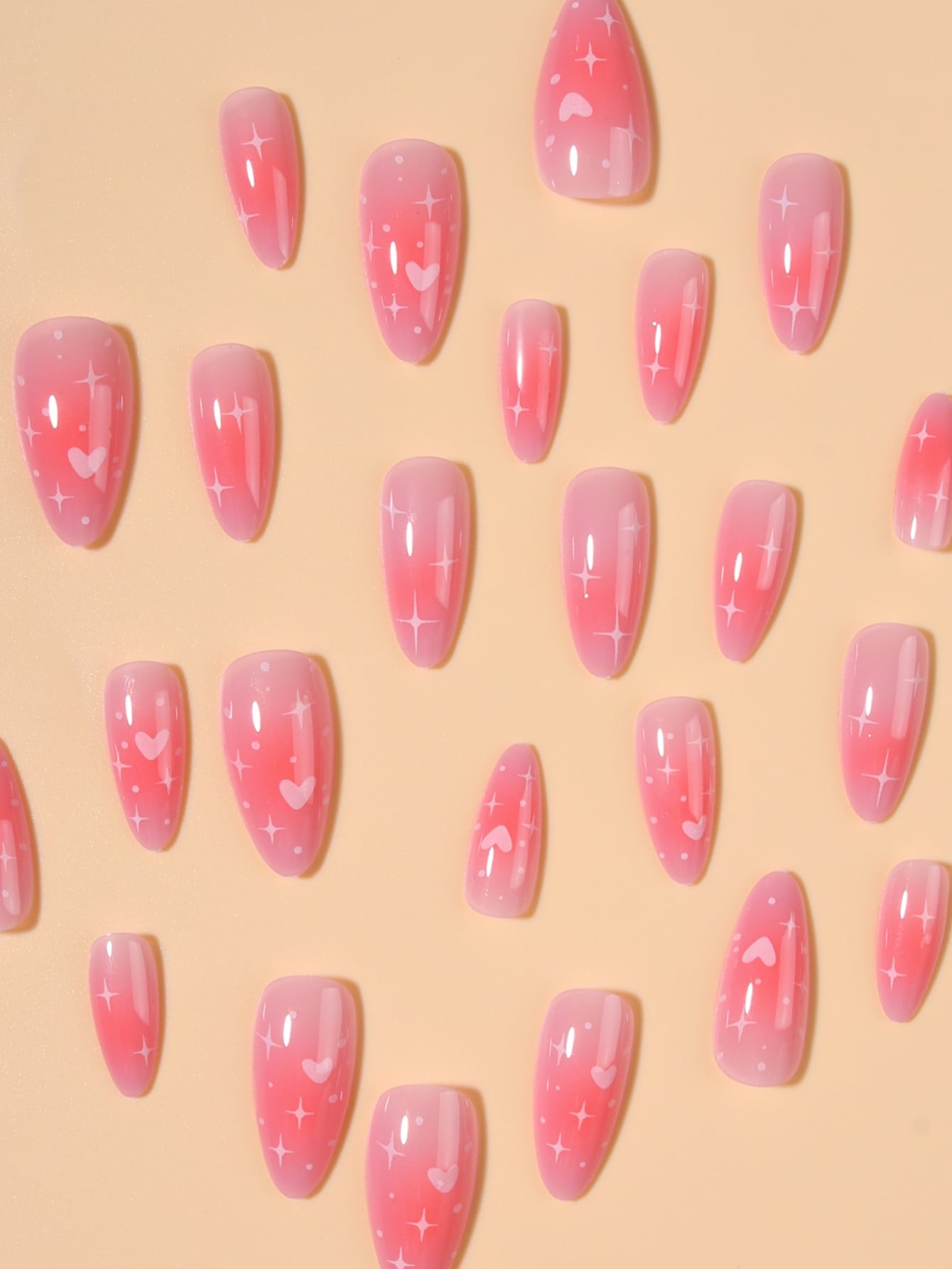 Transform Your Nails with 24Pcs Pink Gradient Long Almond Shaped Fake Nails Set with Heart and Star Design, Comes with 1Pc Nail File and 1Pc Jelly Glue